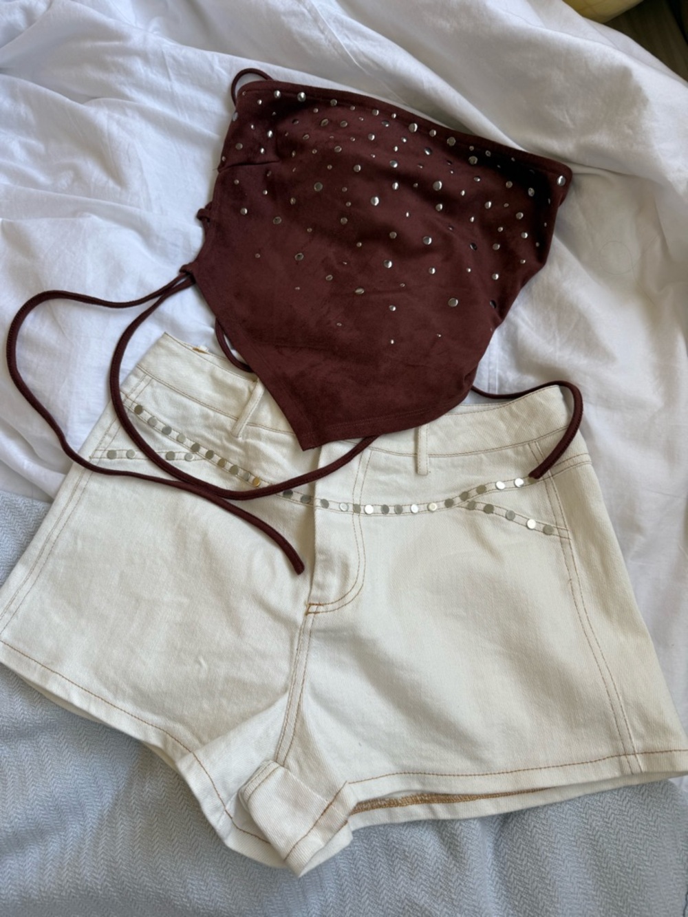 Festival Outfit. Corset tie top and white studded shorts.